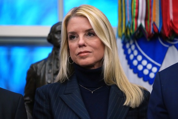 FILE - Attorney General Pam Bondi listens as President Donald Trump speaks at an event on addiction recovery in the Oval Office of the White House, Jan. 29, 2026, in Washington. (AP Photo/Allison Robb ...
