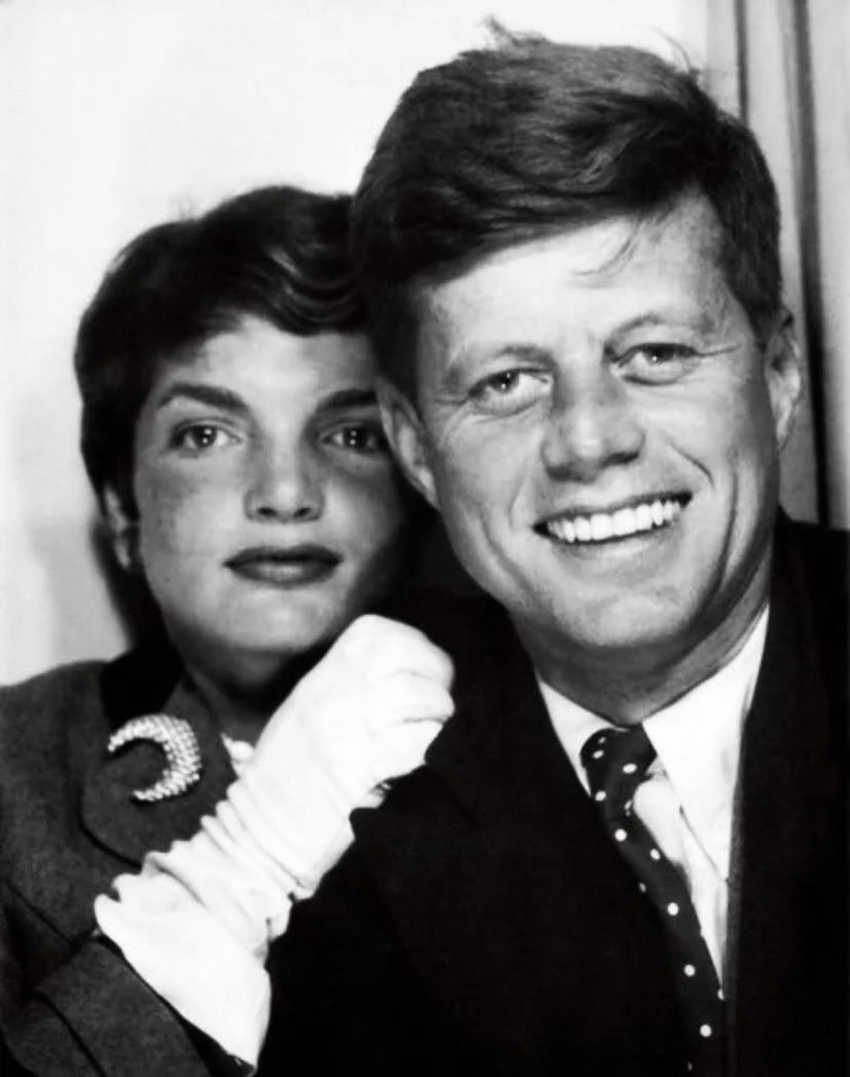 Newlyweds John F. Kennedy (then a U.S. Senator from Massachusetts) and Jacqueline Bouvier Kennedy.

When: Late 1953.

Where: An automated photobooth in New York City (or taken while traveling during t ...