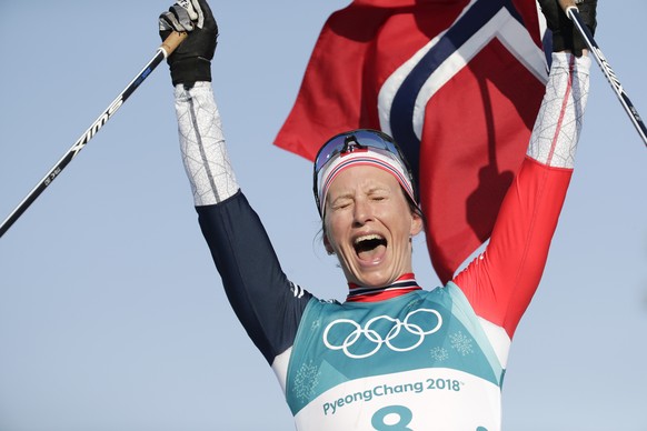 Marit Bjoergen, of Norway, celebrates after winning the gold medal in the women&#039;s 30k cross-country skiing competition at the 2018 Winter Olympics in Pyeongchang, South Korea, Sunday, Feb. 25, 20 ...