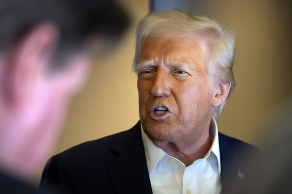 President Donald Trump speaks to reporters aboard Air Force One as he travels from Las Vegas to Miami on Saturday, Jan. 25, 2025. (AP Photo/Mark Schiefelbein)
Donald Trump