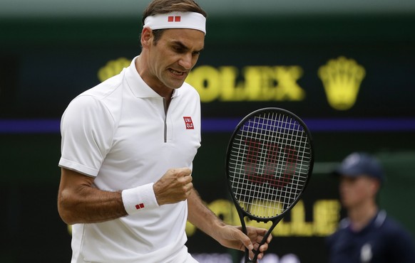Switzerland&#039;s Roger Federer celebrates after winning a point against Lucas Pouile of France in a Men&#039;s singles match during day six of the Wimbledon Tennis Championships in London, Saturday, ...