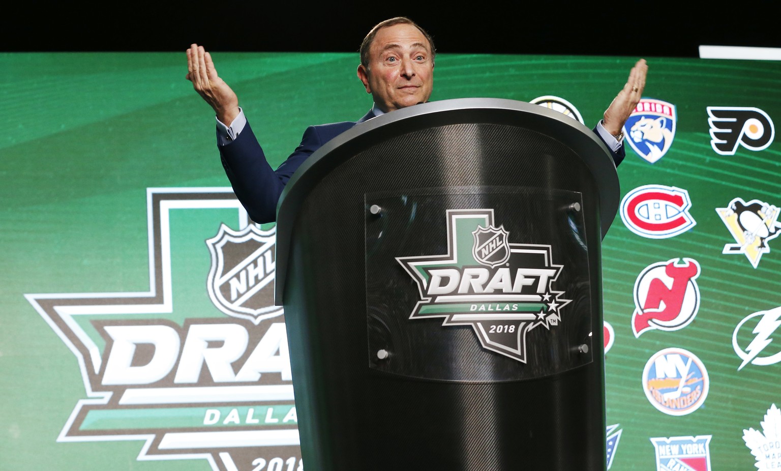 NHL Commissioner Gary Bettman reacts as hockey fans boo him during the NHL hockey draft in Dallas, Friday, June 22, 2018. (AP Photo/Michael Ainsworth)