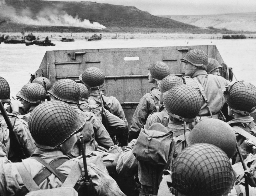 RECORD DATE NOT STATED D-Day - Just before landing in France Just before landing in France, American assault troops mass behind the protective front section of their landing craft as it approaches the ...