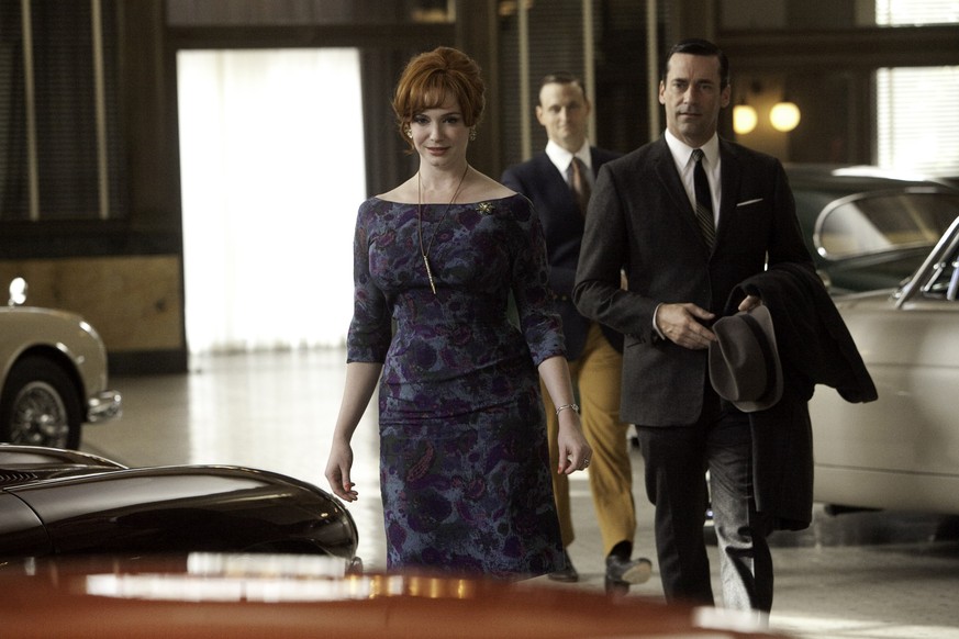 In this image released by AMC, Christina Hendricks, portraying Joan Harris, left, and Jon Hamm portraying Don Draper appear in a scene from the fifth season of &quot;Mad Men.&quot; In the episode, the ...