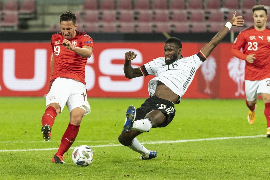 epa08741908 Switzerland&#039;s Mario Gavranovic (L) in action against Germany&#039;s Antonio Ruediger during the UEFA Nations League group stage, League A, group 4 soccer match between Germany and Swi ...