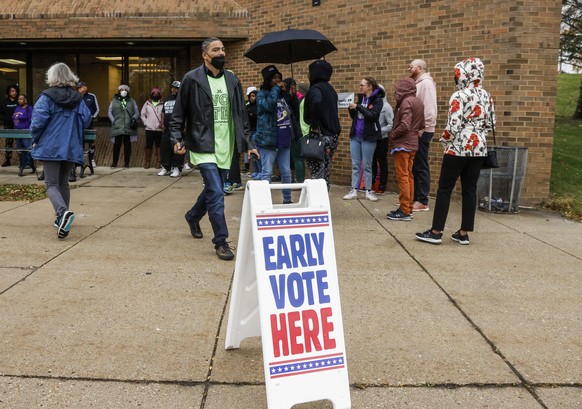 epa10265401 Voters line up for early voting at the Clinton Rose Senior Center in Milwaukee, Wisconsin, USA, 25 October 2022. The Mid-term elections in the US will be held 08 November 2022. EPA/TANNEN  ...