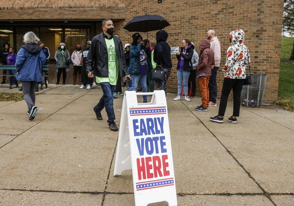 epa10265401 Voters line up for early voting at the Clinton Rose Senior Center in Milwaukee, Wisconsin, USA, 25 October 2022. The Mid-term elections in the US will be held 08 November 2022. EPA/TANNEN  ...