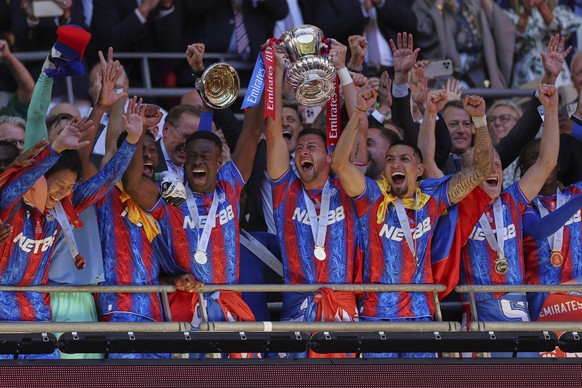 Crystal Palace players lift the trophy after the FA Cup final between Manchester City and Crystal Palace at the Wembley Stadium in London, Saturday, May 17, 2025. (AP Photo/Ian Walton)
Britain Soccer  ...