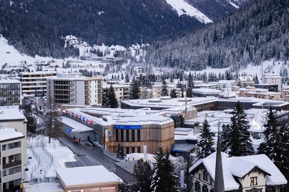 The Davos Congress Center, downtown, where the World Economic Forum will take place, is covered in snow on Saturday, January 13, 2024, in Davos, Switzerland.  The annual meeting of the World Economic Forum is…