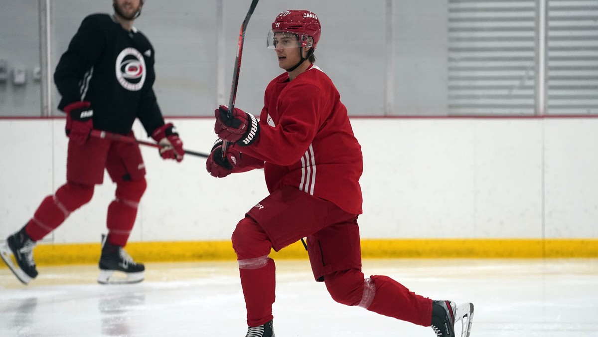 Carolina Hurricanes' Sebastian Aho, of Finland, follows through with a shot during NHL hockey training camp in Morrisville, N.C., Wednesday, Jan. 6, 2021. (AP Photo/Gerry Broome)