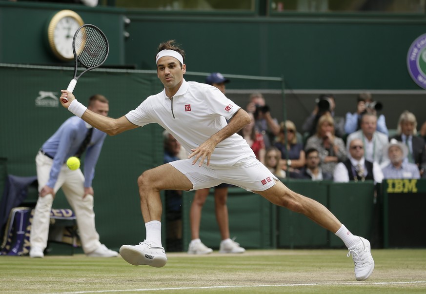 FILE - Switzerland&#039;s Roger Federer returns the ball to Serbia&#039;s Novak Djokovic during the men&#039;s singles final match of the Wimbledon Tennis Championships in London, in this Sunday, July ...