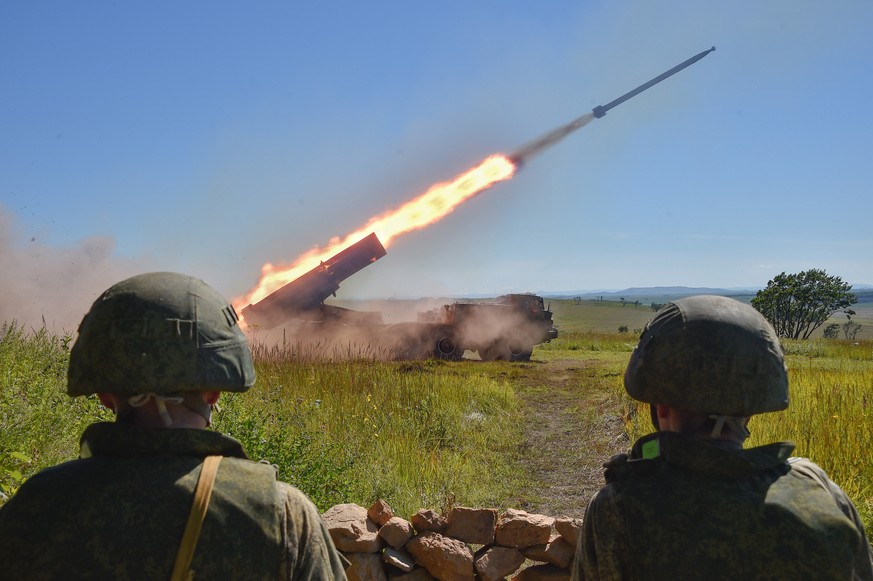 epa10163910 A handout photo made available by the press service of the Russian Defence Ministry on 06 September 2022 shows Russian servicemen firing a BM-27 Uragan (Hurricane) multiple rocket launch s ...