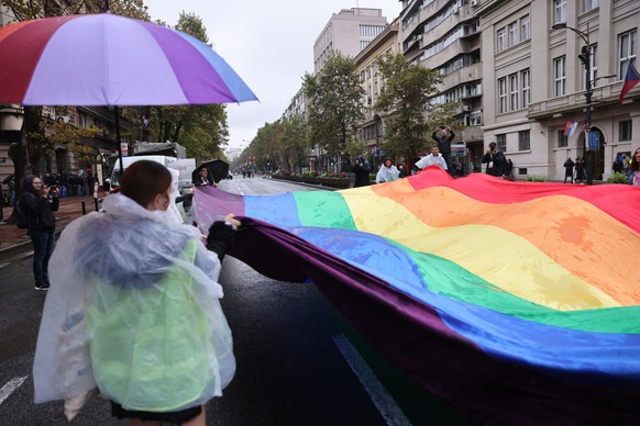 epa10190260 Activists wave a rainbow colored flag ahead of the EuroPride march in Belgrade, Serbia, 17 September 2022. EuroPride, a pan-European international event dedicated to LGBTQ pride, is hosted ...