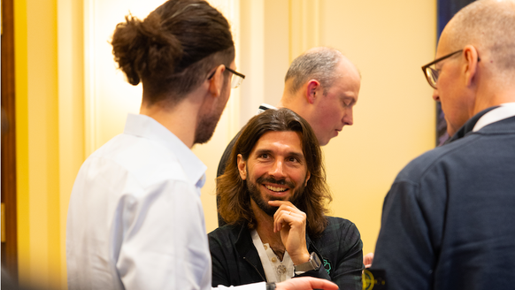 Bitcoin Suisse co-founder Fabian Hediger (left) talking to Swissborg CEO.
