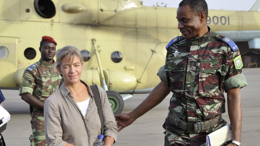 FILE - In this April 24, 2012, file photo, released Swiss hostage Beatrice Stoeckli, left, stands in Ouagadougou, Burkina Faso, following arrival by helicopter from Timbuktu, Mali, after being handed  ...