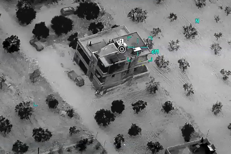 This image from video provided by the Department of Defense and released on Feb. 3, 2022, shows the compound before a raid where Abu Ibrahim al-Hashimi al-Qurayshi, leader of the Islamic State Group,  ...