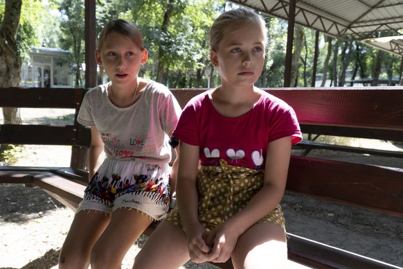 Ukrainian children Olesya Lyadchenko, left, and Yaroslava Rogachyova attend a camp in Zolotaya Kosa, the settlement on the Sea of Azov, Rostov region, southwestern Russia, Friday, July 8, 2022. An Ass ...