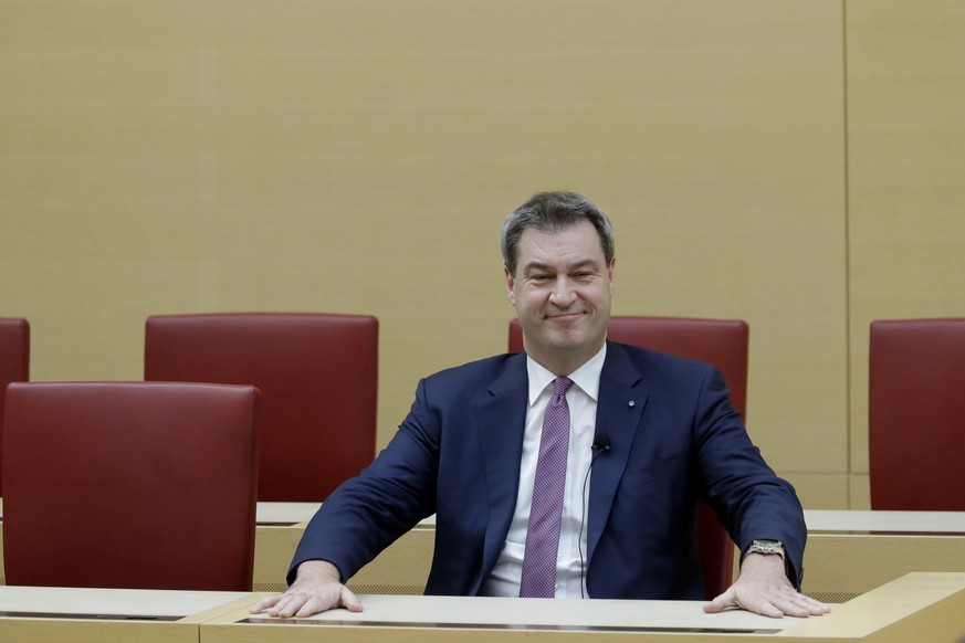 Bavarian State Governor Markus Soeder takes his place after he was elected for his second term in the Bavarian parliament in Munich, Germany, Tuesday, Nov. 6, 2018. (AP Photo/Matthias Schrader)