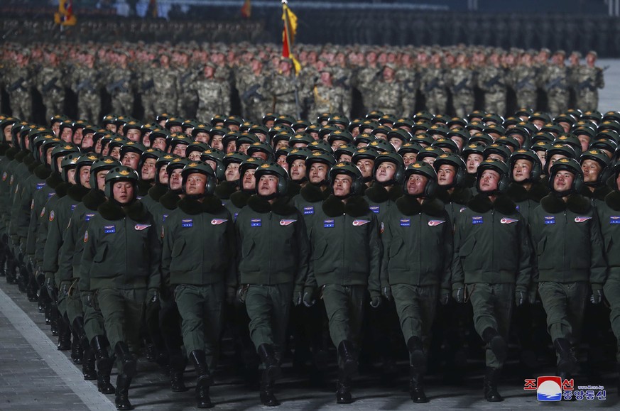 In this photo provided by the North Korean government, North Korean soldiers march in formation during a military parade marking the ruling party congress, at Kim Il Sung Square in Pyongyang, North Ko ...