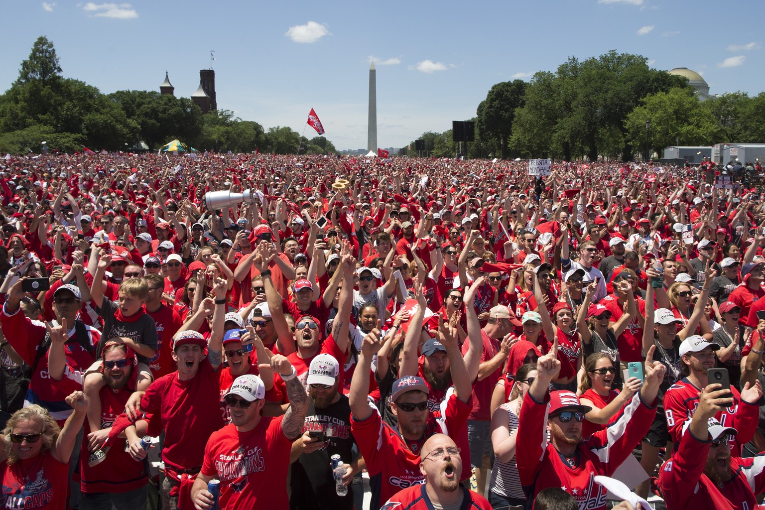 epa06803171 Fans cheer during a victory celebration for the 2018 Stanley Cup Champions Washington Capitals, on the National Mall in Washington, DC, USA, 12 June 2018. No professional Washington sports ...