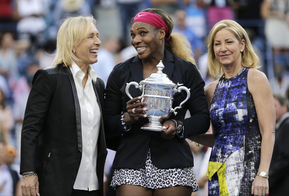 Martina Navratilova, left, and Chris Evert, right, pose for a photo with Serena Williams after Williams defeated Caroline Wozniacki, of Denmark, in the championship match of the 2014 U.S. Open tennis ...