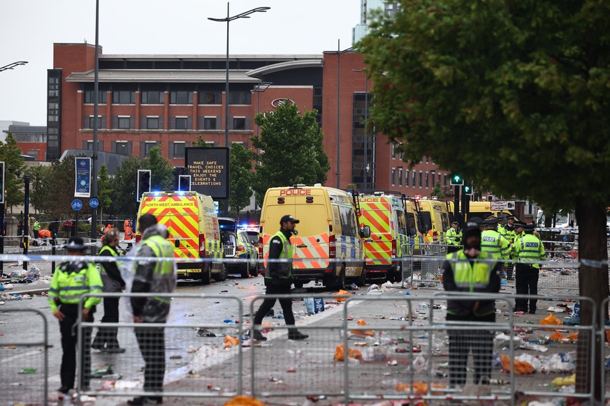 epaselect epa12137424 The scene where a car collided with Liverpool supporters during the trophy parade in Liverpool city centre, Britain, 26 May 2025. A man has been detained after the collision with ...