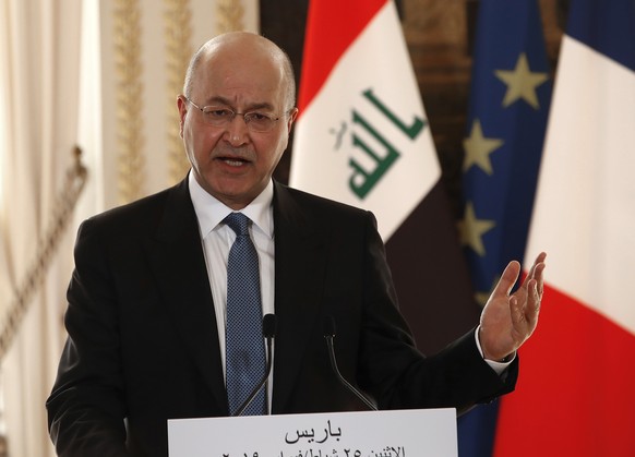 epa07396930 Iraqi President Barham Saleh speaks at a joint media conference with the French president at the Elysee Palace in Paris, France, 25 February 2019. Saleh is on a two-day visit to France wit ...