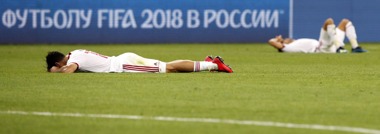 epa06840301 Players of Iran react after losing the FIFA World Cup 2018 group B preliminary round soccer match between Iran and Portugal in Saransk, Russia, 25 June 2018.

(RESTRICTIONS APPLY: Editor ...