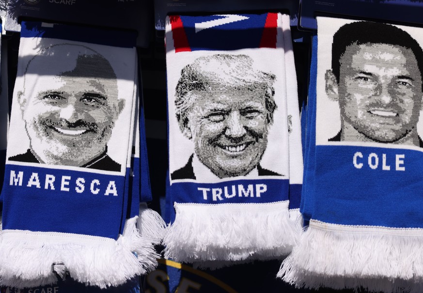epa12306184 Scarves featuring US President Donald Trump are displayed outside the stadium ahead of the English Premier League match between Chelsea FC and Crystal Palace, in London, Britain, 17 August ...