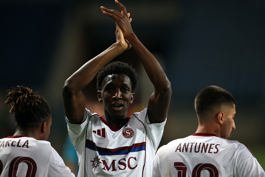 epa12315245 Lamine Fomba (C) of Servette FC celebrates after scoring the 1-0 lead during the UEFA Conference League qualifiers fourth round, first leg match between Shakhtar Donetsk and Servette FC in ...