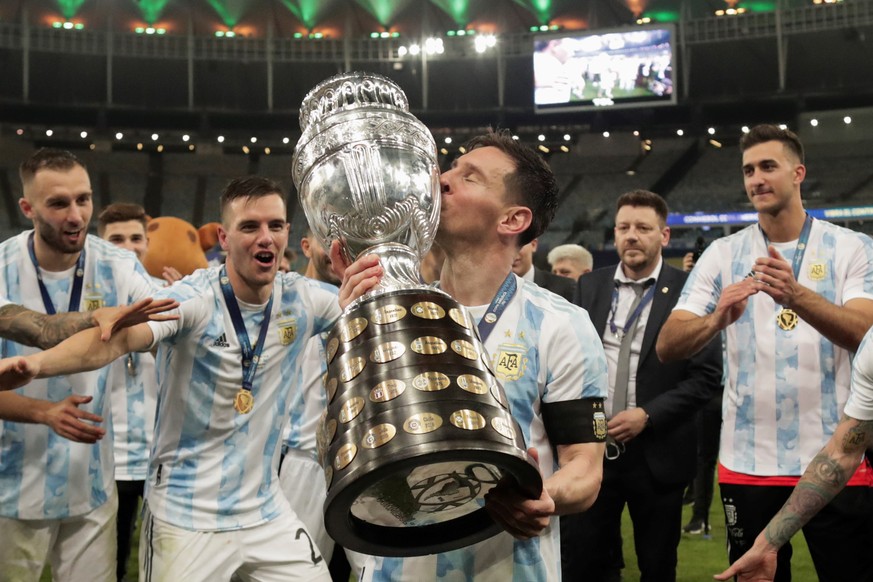 epa09336512 Lionel Messi of Argentina kisses the Copa America trophy after the Copa America 2021 final between Argentina and Brazil at the Maracana Stadium in Rio de Janeiro, Brazil, 10 July 2021. EPA ...