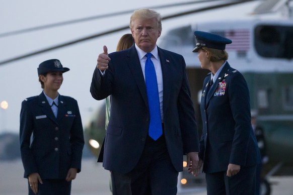 President Donald Trump, with first lady Melania Trump, gives a thumbs up as the walk to Air Force One, as they depart Sunday, June 2, 2019, at Andrews Air Force Base, Md. Trump is going to London, Fra ...