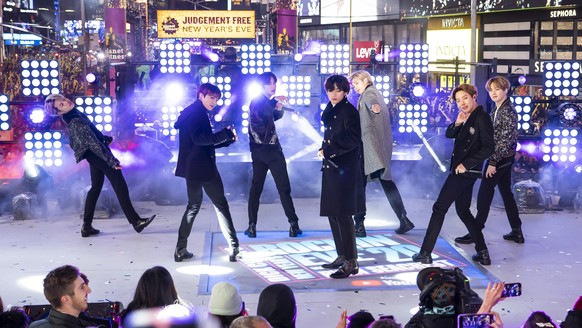 FILE - Members of BTS perform at the Times Square New Year's Eve celebration in New York on Dec. 31, 2019. The South Korean boy band BTS HAS won a leading four awards including best song for