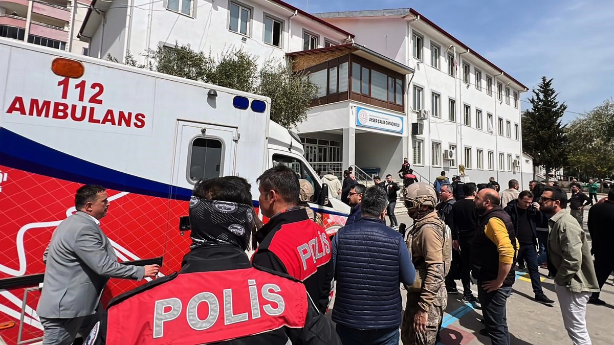 Turkish security forces and emergency staff stand in the courtyard of a secondary school where an assailant opened fire, in Kahramanmaras, Turkey, Wednesday, April 15, 2026, (IHA via AP)
Turkey School ...