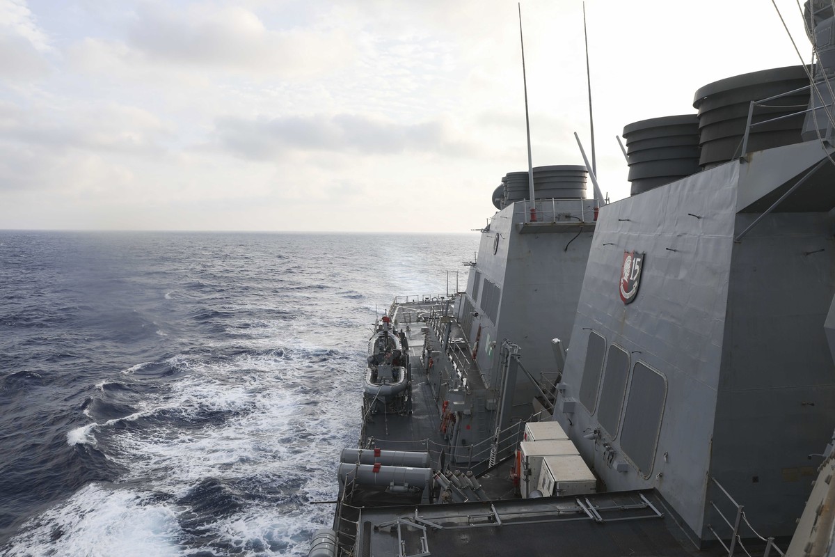 In this photo provided by the U.S. Navy, the Arleigh Burke-class guided-missile destroyer USS Milius (DDG 69) conducts routine underway operations in South China Sea, Friday March 24, 2023. China thre ...