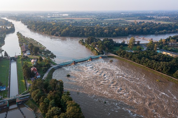 epa11613258 An aerial picture taken with a drone shows the surging waters of the Odra river, following heavy rains brought by Storm Boris, in Wroclaw, southwestern Poland, 19 September 2024. Since 13  ...