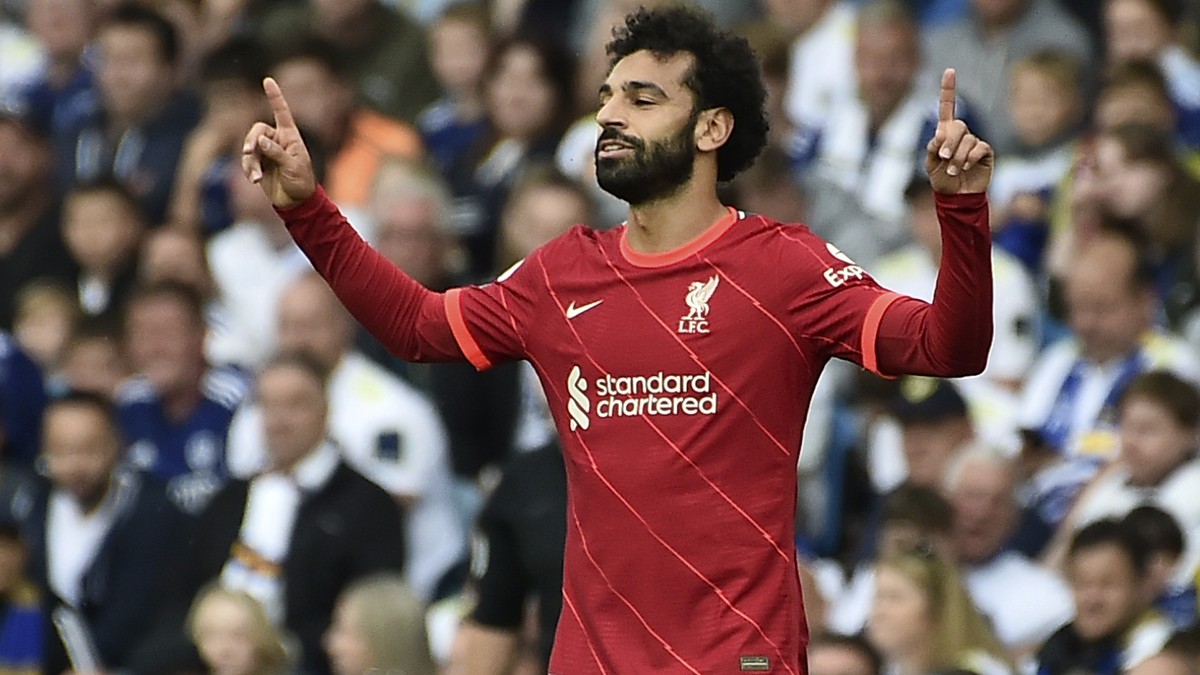 Liverpool's Mohamed Salah celebrates after scoring the opening goal during the English Premier League soccer match between Leeds United and Liverpool at Elland Road, Leeds, England, Sunday, Sept. ...