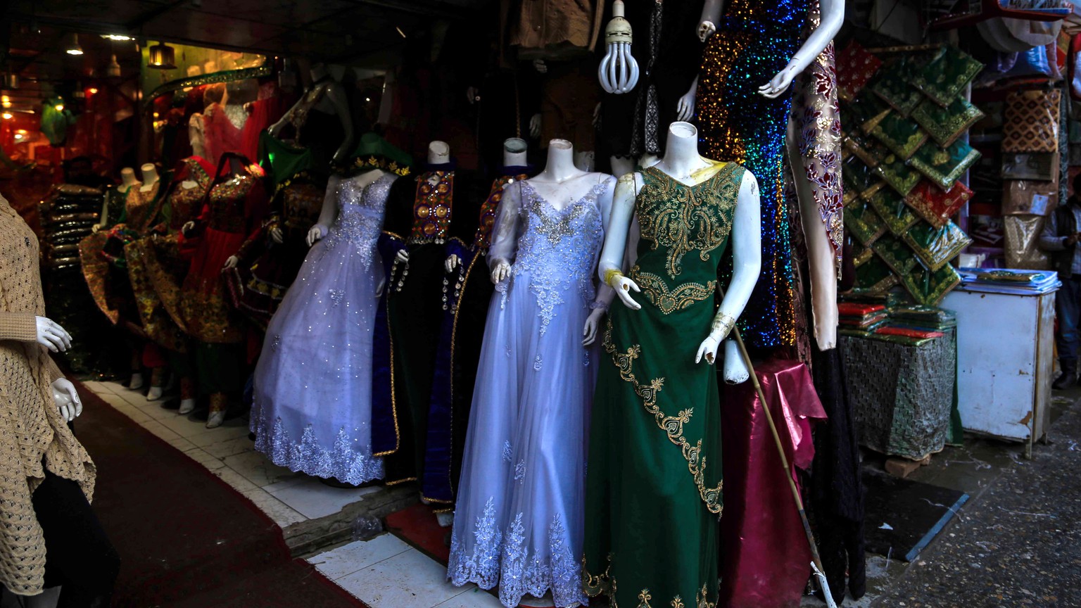 epa09706884 Dresses are displayed on head-less mannequins at a shop in Kabul, Afghanistan, 23 January 2024 (issued 24 January 2024). The Taliban has ordered mannequin heads to be removed from shops in ...