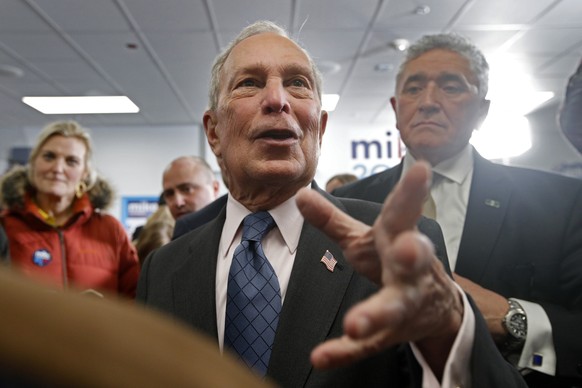 Democratic presidential candidate and former New York City Mayor Michael Bloomberg, center, greets supporters at a campaign office, Monday, Jan. 27, 2020, in Scarborough, Maine. (AP Photo/Robert F. Bu ...