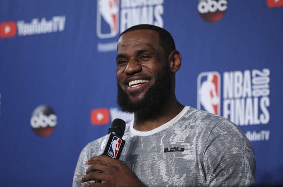 Cleveland Cavaliers forward LeBron James takes questions at a press conference after the basketball team&#039;s practiced during the NBA Finals, Thursday, June 7, 2018, in Cleveland. The Warriors lead ...