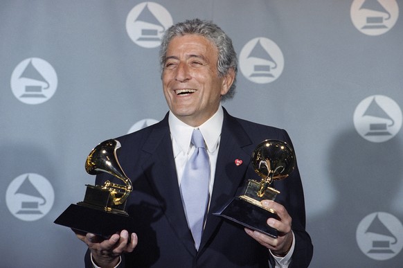 FILE - Veteran singer Tony Bennett displays his two Grammy&#039;s backstage at the Shrine Auditorium in Los Angeles Wednesday, March 1, 1995. Bennett, the eminent and timeless stylist whose devotion t ...