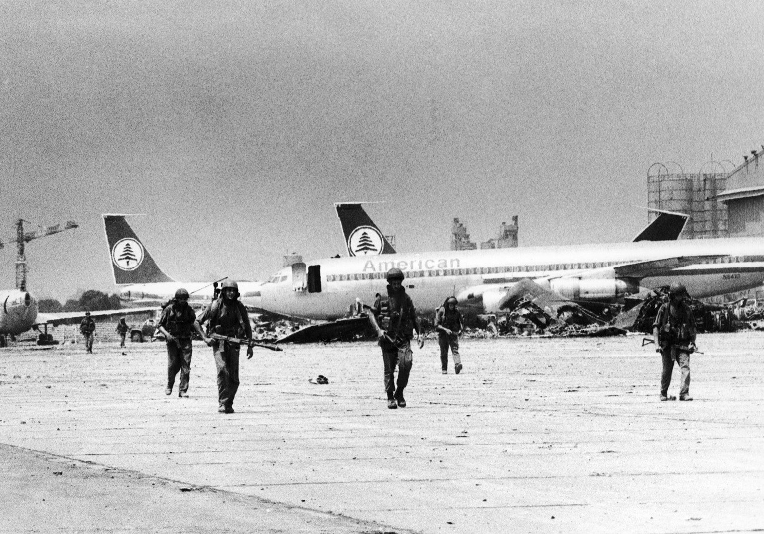 Israeli soldiers patrol the tarmac of Beirut International Airport, on Aug. 4, 1982, as fighting between the PLO and Israeli forces contunues after Israeli troops attack PLO positions around the besie ...