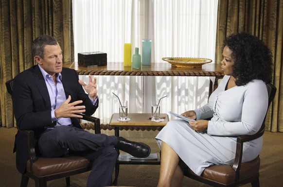 This Monday, Jan. 14, 2013 photo provided by Harpo Studios Inc., shows talk-show host Oprah Winfrey interviewing cyclist Lance Armstrong during taping for the show "Oprah and Lance Armstrong: The ...