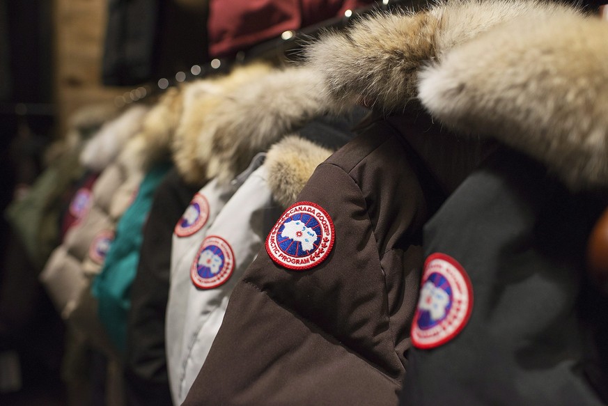 FILE - In this Nov. 28, 2013, file photo, garments hang on display at the Canada Goose Inc. showroom in Toronto, Canada Goose, one of the world&#039;s leading makers of extreme weather outerwear, is s ...