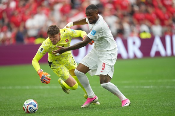 epa13061663 Goalkeeper Gregor Kobel of Switzerland (L) and Cyle Larin of Canada in action during the FIFA World Cup 2026 group stage match Switzerland against Canada, in Vancouver, Canada, 24 June 202 ...