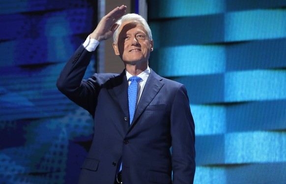 Former President Bill Clinton salutes the crowd as he arrives to speak on the second night at the Democratic National Convention in Philadelphia, Pennsylvania, U.S., July 26, 2016. REUTERS/Jim Young