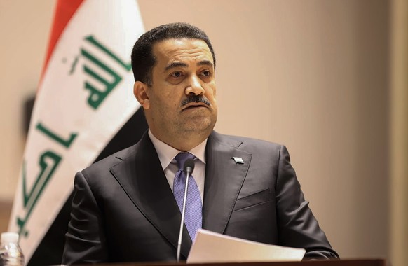 This photo provided by Iraqi Parliament Media Office, shows Mohammed Shia al-Sudani, a candidate for Iraq's prime minister position, speaks during the parliamentary session to vote on the new governme ...