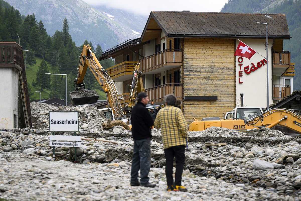 General view of rubble from a landslide following storms that caused major flooding in Saas-Grund, Switzerland, Sunday, June 30, 2024. Massive thunderstorms and rainfall led to a flooding situation wi ...