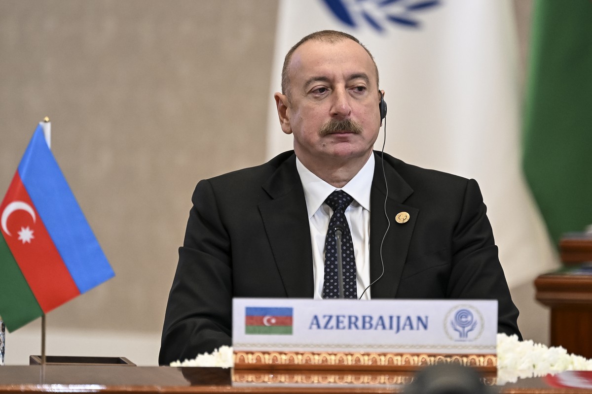 In this photo released by Uzbekistan's President Press Office, Azerbaijan's President Ilham Aliyev attends the Summit of the Economic Cooperation Organisation (ECO) in Tashkent, Uzbekistan,  ...