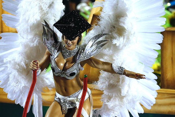 epa07412438 A member of the samba school of the Grupo Especial Academicos do Grande Rio parade during the Carnival celebration at the Marques de Sapucai sambadrome in Rio de Janeiro, Brazil, early 04  ...